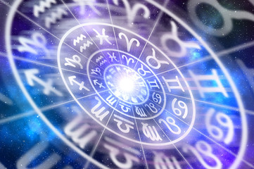 Zodiac signs inside of horoscope circle on universe background