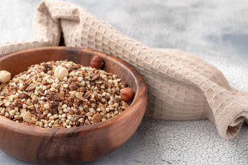 Healthy breakfast, vegan vegetarian granola made of green buckwheat with nuts and pumpkin seed