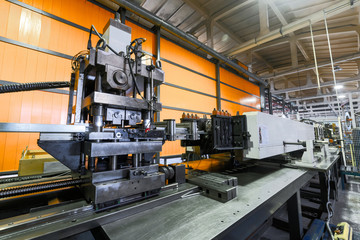 Roller forming machine. The interior of the plant producing a metal profile.