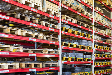 Factory warehouse steel reinforcement. High stacked shelving.