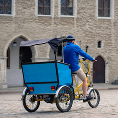 Tricycle taxi for tourists on city center street