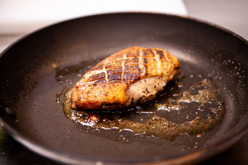Delicious duck breast cooked in pan. Making delicious meal