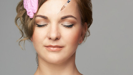 Face needle injection. Young woman cosmetology procedure. Doctor gloves. Wrinkles