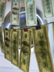 background. defocusing. one hundred dollar bills after washing. offshore money laundering.