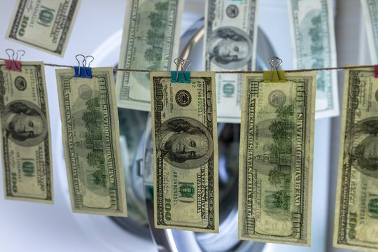 background. defocusing. one hundred dollar bills after washing. offshore money laundering.