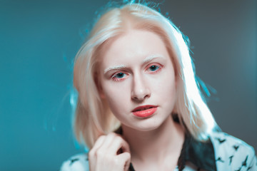 portrait of blonde albino girl in studio