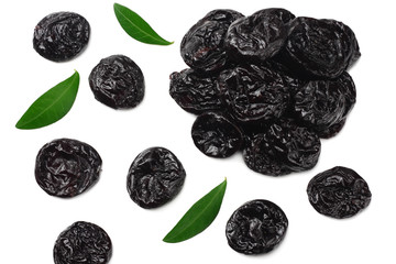 Dried plums - prunes with green leaves isolated on white background. top view