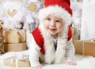 Little girl (eight months of age) dressed as Santa