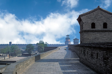 Pingyao City Wall - Shanxi, China. The walls surrounding the city of Pingyao were first built in...
