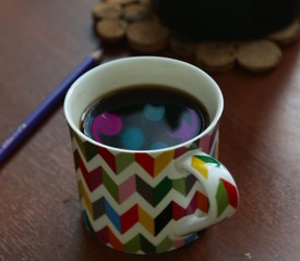 Garland reflection in the cup of coffee 