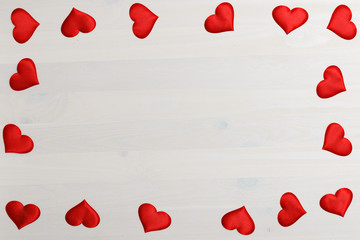 Closeup of red heart on a white wooden background with space for copy. Valentine's day celebration concept