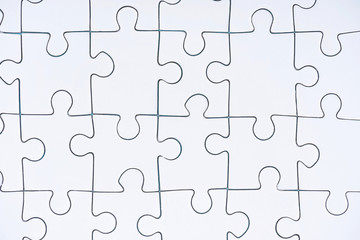 full frame of white puzzle pieces background