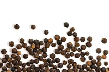 image of black pepper seeds on white background. Food.