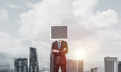 Businessman with monitor instead of head.
