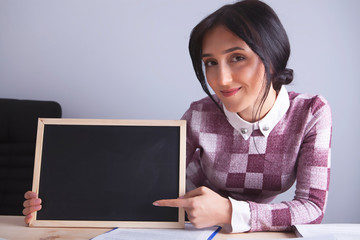 businesswoman showing office board