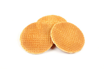 Round ruddy waffle isolated on white background.