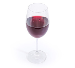 Glass of red wine on a white background