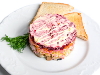 Salad herring under a fur coat, isolated on white background.