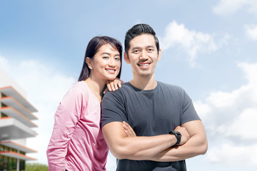 Young asian couple with the woman lean back on the man shoulder