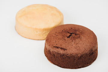 delicious homemade white and brown cakes isolated on white