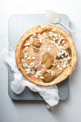 Tart with poached pears and almond frangipane