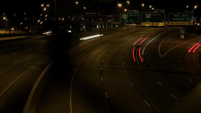 Timelapse of cars driving at night on american interstate