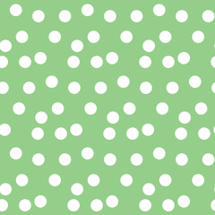Pastel green background scattered dots polka seamless pattern