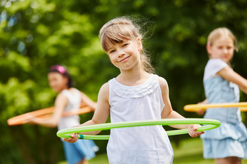 Girl with hula hoop © Robert Kneschke
