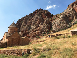 Noravank is a 13th-century Armenian monastery, located in a narrow gorge which is known for its tall, sheer, brick-red cliffs, directly across from the monastery.