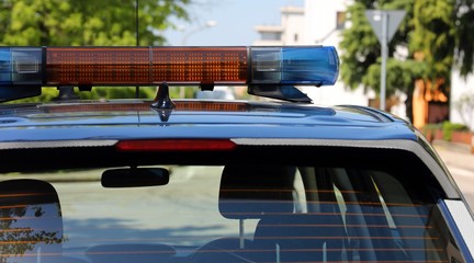 sirens of police car in city streets without people during the r