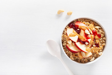 apple peanut butter quinoa bowl with jam and cashew for healthy breakfast - Powered by Adobe
