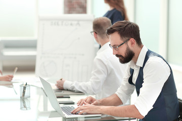 close up. businessman working on a laptop