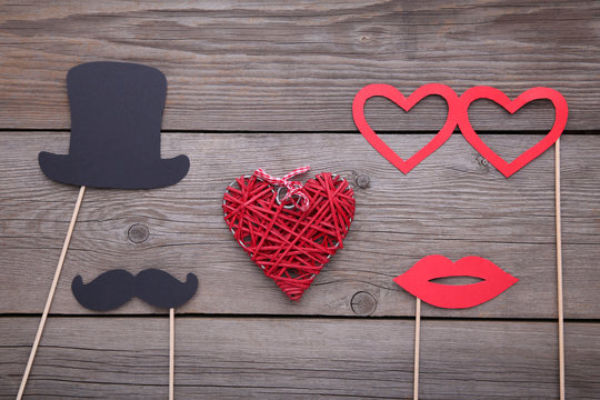 Photo booth colorful props for party with heart on grey background