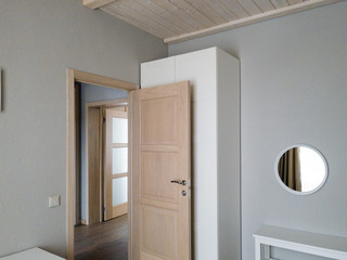 Clean modern room with round mirror