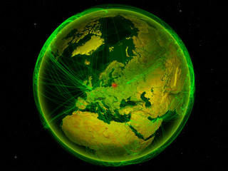 Lithuania from space on planet Earth with digital network representing international communication, technology and travel.