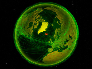 Iceland from space on planet Earth with digital network representing international communication, technology and travel.