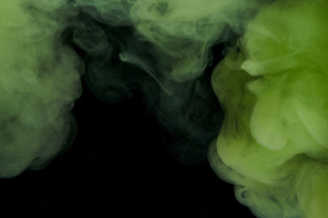 Fototapeta premium Green ink and black background