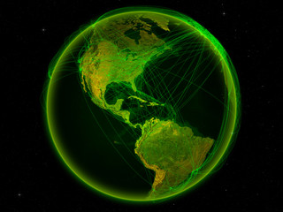 Jamaica from space on planet Earth with digital network representing international communication, technology and travel.