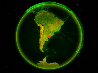 Uruguay from space on planet Earth with digital network representing international communication, technology and travel.