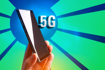 Cellular. 5G. Cellular telephone. 5G broadband network. The fifth generation of mobile communications. Phone in hand. Data transfer rate Communication standard