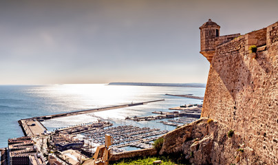 View of Alicante marina and historic Santa Barbara castle. - obrazy, fototapety, plakaty