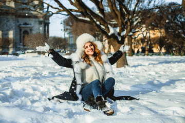 Fototapeta na wymiar Nice winter girl having fun outdoor