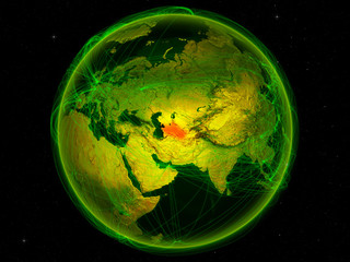 Turkmenistan from space on planet Earth with digital network representing international communication, technology and travel.