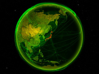 Japan from space on planet Earth with digital network representing international communication, technology and travel.