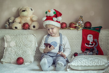 Baby is playing with New Year's toys