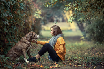 Girl walking with a dog