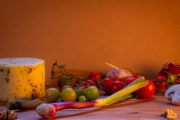 Various foods and other edibles on a rustic background.