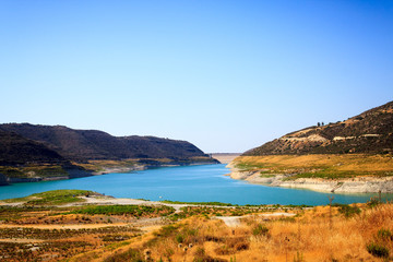 Obraz premium Beautiful view of the blue lake surrounded by mountains on the island of Cyprus