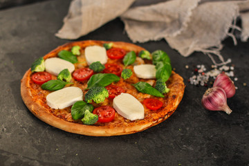 pizza, broccoli, tomato sauce, cheese and more. food background