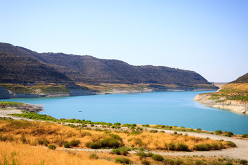 Fototapeta na wymiar Beautiful view of the blue lake surrounded by mountains on the island of Cyprus